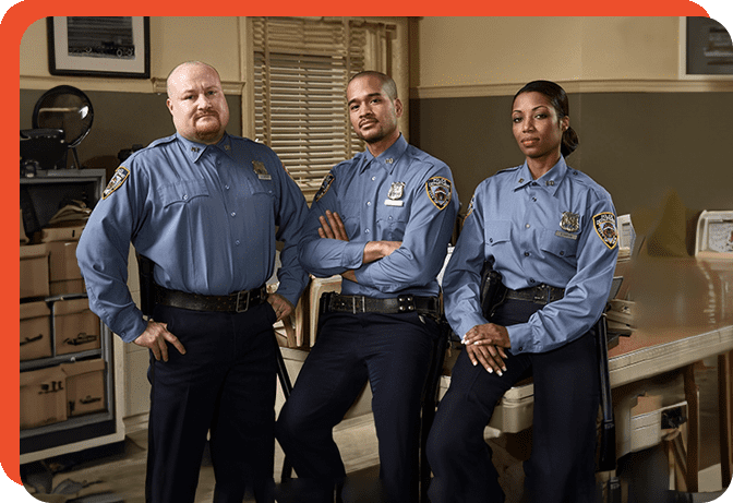 Three police officers posing for a picture.