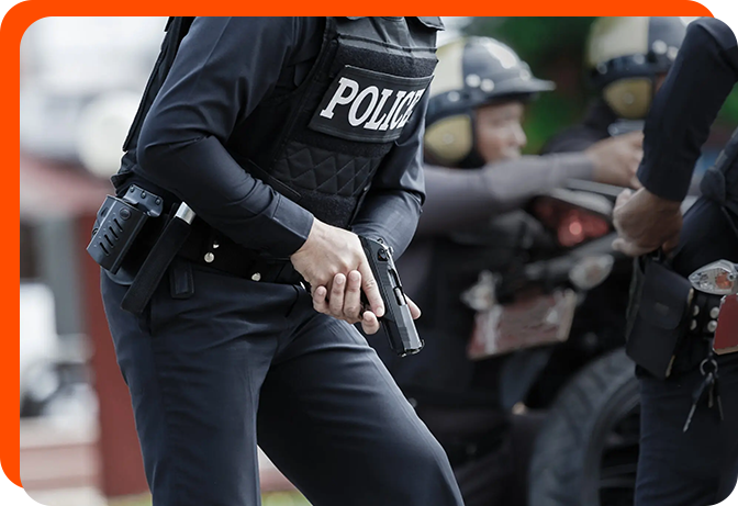 A police officer holding his hand out to another person.